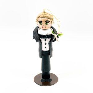 Groom with blond hair wearing a tuxedo.